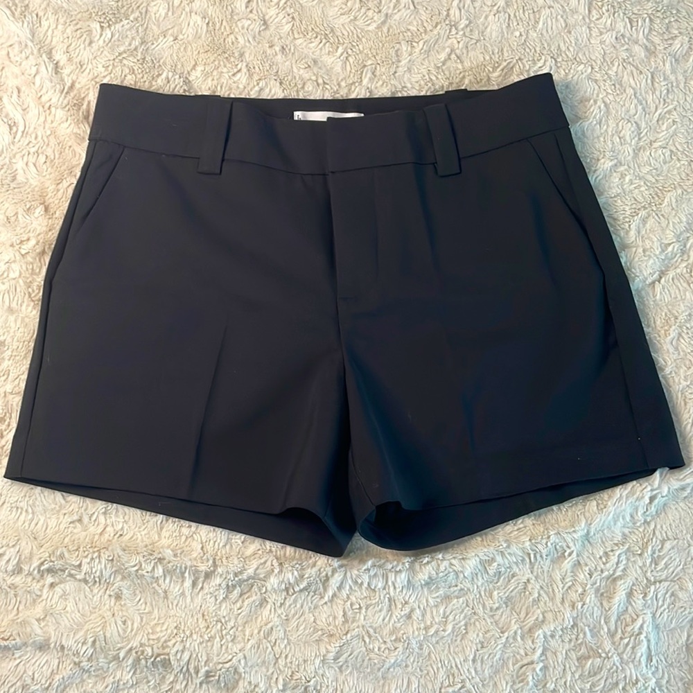 Mango. Black shorts.